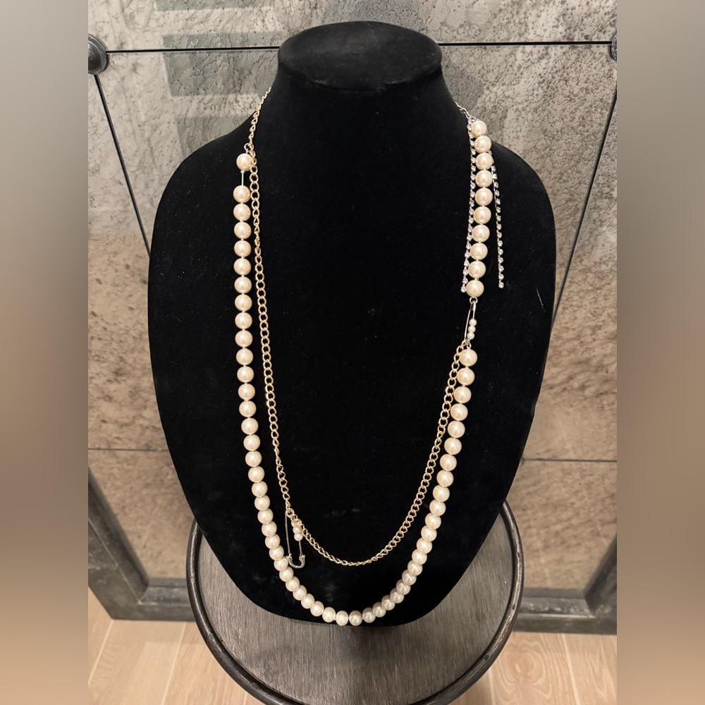 Betsey Johnson Gold and Cream Pearl Necklace With Rhinestone Safety Pin Detail.